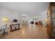 Open-concept living space with tile flooring and multiple seating areas and dining space at 1549 San Christopher Dr, Dunedin, FL 34698