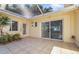 Enclosed patio with tiled floors, offering a versatile space for relaxation and entertaining at 1549 San Christopher Dr, Dunedin, FL 34698