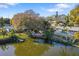 Stunning waterfront property featuring a wooden dock and beautiful views of the lake at 1549 San Christopher Dr, Dunedin, FL 34698