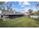 Backyard showing the patio and screened lanai at 1613 Dusty Rose Ln, Brandon, FL 33510