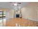 Spacious living room featuring a decorative fireplace, high ceilings, and sliding door access to the exterior at 1613 Dusty Rose Ln, Brandon, FL 33510