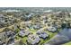 Aerial view of a tranquil neighborhood with lush trees and serene lakes at 2175 Corinne S Ct # A, St Petersburg, FL 33712