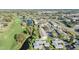 An aerial view showcasing a golf course community by the water at 2175 Corinne S Ct # A, St Petersburg, FL 33712