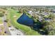 Aerial view of a community with a pond, golf course and lovely residences at 2175 Corinne S Ct # A, St Petersburg, FL 33712
