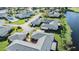 An aerial view of an immaculate residential neighborhood near a pristine pond at 2175 Corinne S Ct # A, St Petersburg, FL 33712