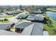An aerial view of an immaculate residential neighborhood near a pristine pond at 2175 Corinne S Ct # A, St Petersburg, FL 33712