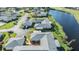 An aerial view of an immaculate residential neighborhood near a pristine pond at 2175 Corinne S Ct # A, St Petersburg, FL 33712