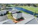 Aerial view of a quiet condo community surrounding a peaceful pond and lush landscaping at 2175 Corinne S Ct # A, St Petersburg, FL 33712