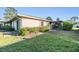 Backyard of house with beautiful landscaping and well-maintained grass at 2175 Corinne S Ct # A, St Petersburg, FL 33712