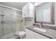 Bathroom with a modern shower, granite countertop, and neutral color palette at 2175 Corinne S Ct # A, St Petersburg, FL 33712