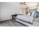 Bedroom featuring a ceiling fan, sliding closet doors and wood-look flooring at 2175 Corinne S Ct # A, St Petersburg, FL 33712