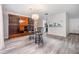 Dining area features updated lighting, a bar height table, and a view into the kitchen at 2175 Corinne S Ct # A, St Petersburg, FL 33712
