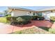 Inviting condo exterior featuring manicured landscaping and a charming walkway to the front entrance at 2175 Corinne S Ct # A, St Petersburg, FL 33712