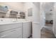 Functional laundry room with white washer and dryer and wire shelving at 2175 Corinne S Ct # A, St Petersburg, FL 33712