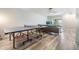 Spacious living room with a ping pong table and sliding glass doors for indoor/outdoor living at 2175 Corinne S Ct # A, St Petersburg, FL 33712