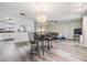 Inviting living room with an eat-in bar, modern light fixture, and comfortable seating area at 2175 Corinne S Ct # A, St Petersburg, FL 33712