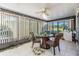 Enclosed lanai with tile floors and ceiling fan at 2175 Corinne S Ct # A, St Petersburg, FL 33712