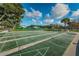 Outdoor shuffleboard courts ready for play under a partly cloudy sky at 2321 Ecuadorian Way # 41, Clearwater, FL 33763