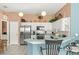 Modern kitchen features stainless steel appliances, lots of cabinets, and nice countertops at 2469 Nantucket Harbor Loop # 123, Sun City Center, FL 33573