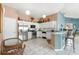 Modern kitchen features stainless steel appliances, lots of cabinets, and nice countertops at 2469 Nantucket Harbor Loop # 123, Sun City Center, FL 33573