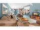 Bright living room with an open floor plan, tile flooring, a neutral color scheme, and a kitchen bar at 2469 Nantucket Harbor Loop # 123, Sun City Center, FL 33573