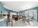 Living room area with many windows, lots of natural light, neutral-colored walls, tile flooring, and modern furnishings at 2469 Nantucket Harbor Loop # 123, Sun City Center, FL 33573