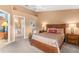 Comfortable main bedroom featuring a ceiling fan, chair, and ensuite bathroom at 2469 Nantucket Harbor Loop # 123, Sun City Center, FL 33573
