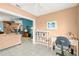 Bright and airy office space with white shelves and desk next to the living room area, perfect for working from home at 2469 Nantucket Harbor Loop # 123, Sun City Center, FL 33573