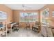 Bright office space with neutral tile flooring, desk, shelves and lots of natural light streaming in through the windows at 2469 Nantucket Harbor Loop # 123, Sun City Center, FL 33573