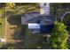 Straight down aerial shot of the house, showing the yard, roof, and landscaping surrounding the property at 38811 Inez Ave, Zephyrhills, FL 33542