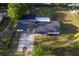 Aerial view of the single story home showcasing the roof, backyard, and surrounding neighborhood at 38811 Inez Ave, Zephyrhills, FL 33542