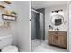 Charming bathroom with a glass shower, modern vanity, and stylish decor at 38811 Inez Ave, Zephyrhills, FL 33542