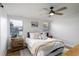 Cozy bedroom with a plush bed, stylish linens, and natural light from windows at 38811 Inez Ave, Zephyrhills, FL 33542