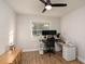Well-lit home office featuring a modern desk, computer setup, and ample workspace at 38811 Inez Ave, Zephyrhills, FL 33542
