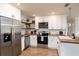 Bright kitchen featuring white cabinetry, stainless steel appliances, and butcher block countertops at 38811 Inez Ave, Zephyrhills, FL 33542