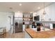 Beautiful kitchen with white cabinets, stainless steel appliances, and butcher block countertops at 38811 Inez Ave, Zephyrhills, FL 33542