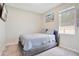 Cozy bedroom with a queen-size bed, soft carpet, and natural light at 4917 Eagle Rock Dr, Wimauma, FL 33598