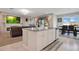 Kitchen island with granite countertops overlooks the living and dining areas at 4917 Eagle Rock Dr, Wimauma, FL 33598