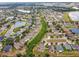 An aerial view of a community highlighting the neatly planned neighborhood layout and scenic ponds at 501 Washita Stone Dr, Ruskin, FL 33570