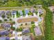 Aerial view of houses in a neighborhood on a cul-de-sac backing up to green space at 501 Washita Stone Dr, Ruskin, FL 33570