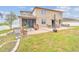 The backyard features a patio and plenty of space for outdoor activities at 501 Washita Stone Dr, Ruskin, FL 33570