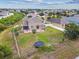 Backyard view of the house and yard with patio, trampoline, seating and a water feature at 501 Washita Stone Dr, Ruskin, FL 33570