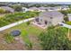 Aerial view of a home showcasing a spacious backyard with a patio area perfect for entertaining guests at 501 Washita Stone Dr, Ruskin, FL 33570