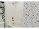 Bathroom featuring a white tile shower and tub combination at 501 Washita Stone Dr, Ruskin, FL 33570