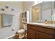 Bathroom with a vanity, toilet, towel rack and shower with glass doors at 501 Washita Stone Dr, Ruskin, FL 33570