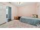 This cozy bedroom is staged with hardwood floors and neutral walls at 501 Washita Stone Dr, Ruskin, FL 33570