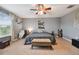Bedroom featuring carpet floors, a ceiling fan, and a large window at 501 Washita Stone Dr, Ruskin, FL 33570
