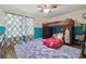 This bedroom offers a playful bunk bed and lots of natural light at 501 Washita Stone Dr, Ruskin, FL 33570