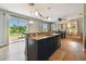 A stylish kitchen with a breakfast bar that opens up into the breakfast nook, and patio at 501 Washita Stone Dr, Ruskin, FL 33570