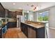 An inviting kitchen with a breakfast bar, dark wood cabinets, and stainless steel appliances at 501 Washita Stone Dr, Ruskin, FL 33570